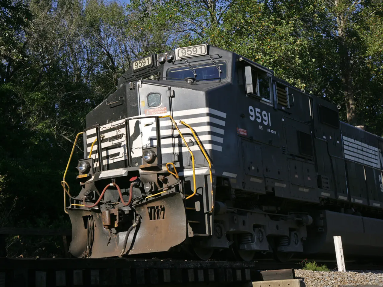 This is the train engine, which is moving on the rail track. I can see number plates attached to...