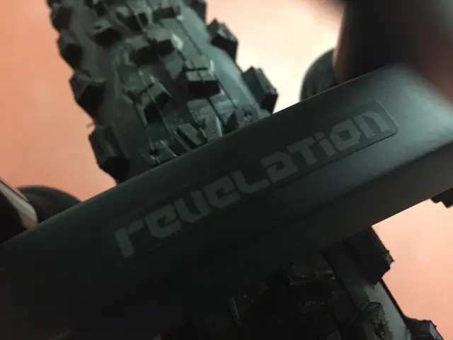 This is a zoom in picture of a bicycle Tyre as we can see in the middle of this image.