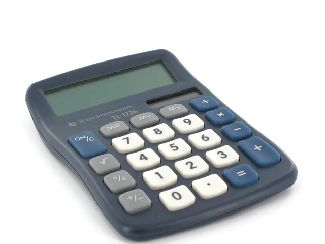 In this picture we can see a calculator.